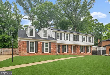 a aerial view of a house with a yard