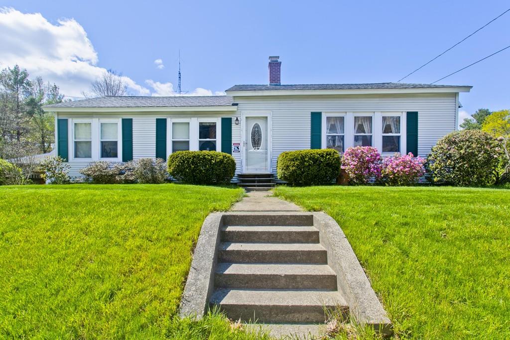 401 Palmer Road Ware, MA 01082 - Photo 1 of 34 a front view of house with yard and green space