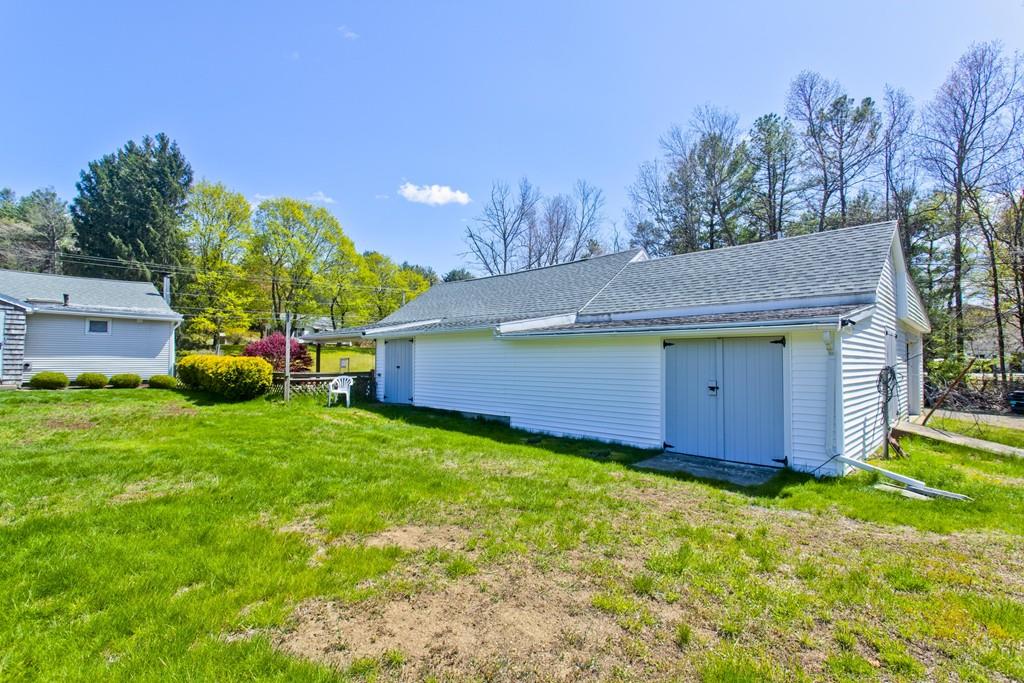 401 Palmer Road Ware, MA 01082 - Photo 11 of 34 a view of a house with a backyard and a garden