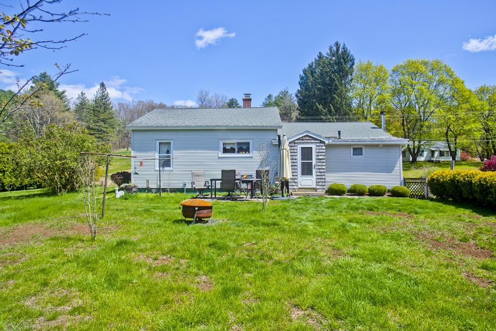 401 Palmer Road Ware, MA 01082 - Photo 12 of 34 a front view of a house with garden