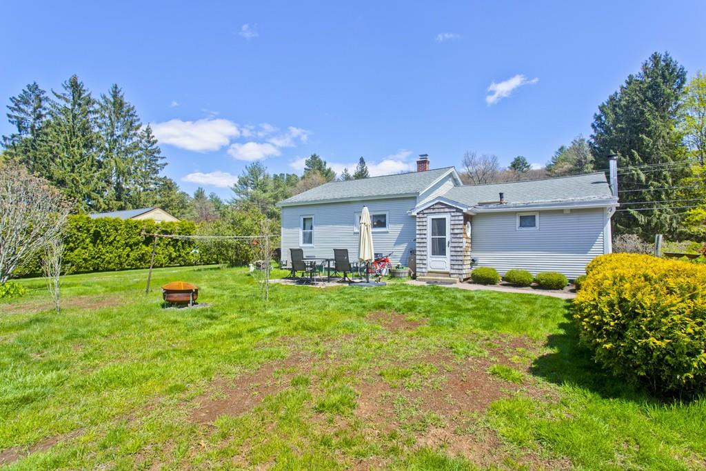 401 Palmer Road Ware, MA 01082 - Photo 13 of 34 a front view of a house with a garden