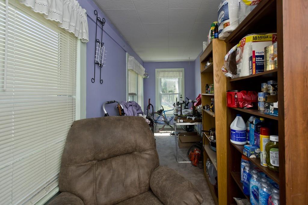 401 Palmer Road Ware, MA 01082 - Photo 23 of 34 a living room with lots of furniture and a fan