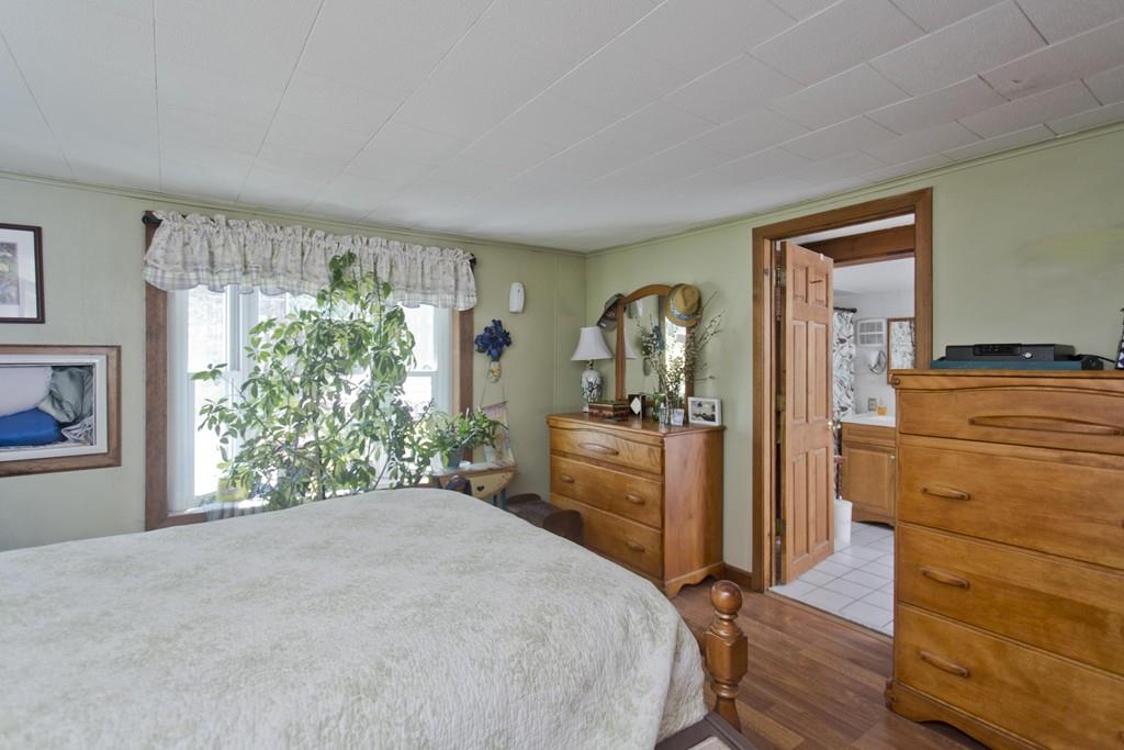 401 Palmer Road Ware, MA 01082 - Photo 25 of 34 a bedroom with a bed and a dresser