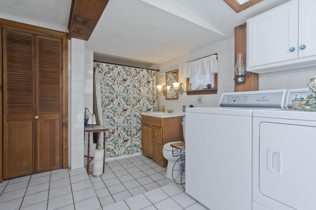 401 Palmer Road Ware, MA 01082 - Photo 29 of 34 a utility room with cabinets washer and dryer
