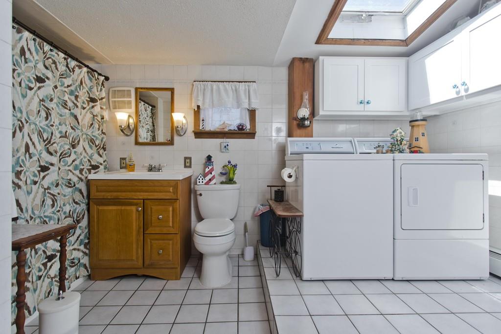 401 Palmer Road Ware, MA 01082 - Photo 30 of 34 a utility room with cabinets washer and dryer
