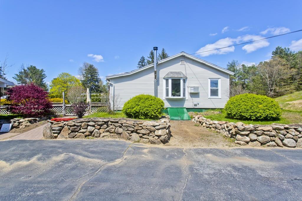 401 Palmer Road Ware, MA 01082 - Photo 6 of 34 a view of a house with a yard and garden