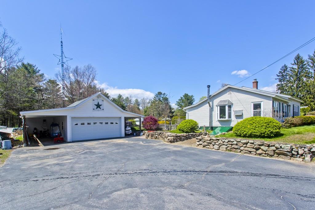 401 Palmer Road Ware, MA 01082 - Photo 8 of 34 a view of a house with a yard and potted plants