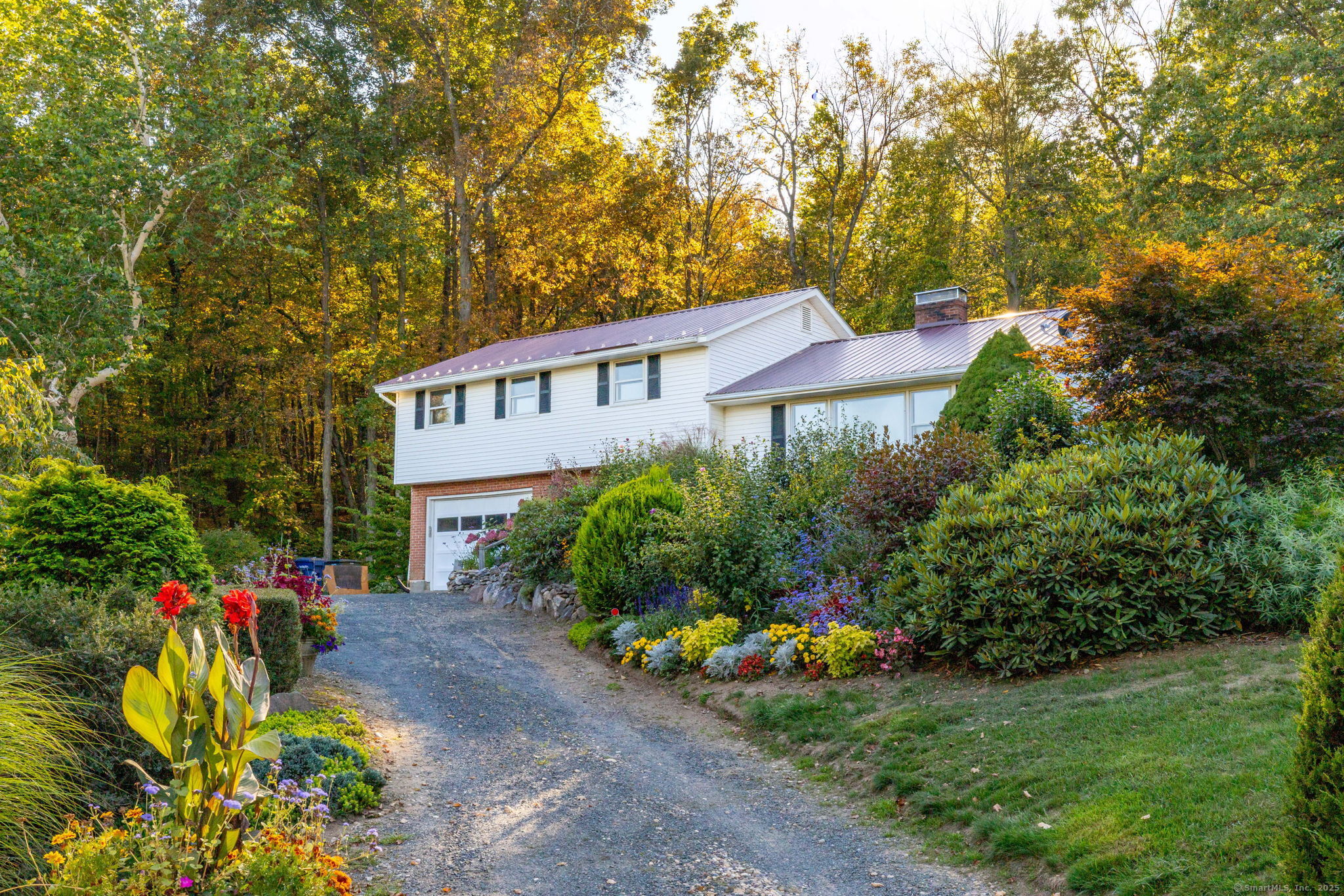 9 Mountain Road Granby, CT 06060 - Photo 1 of 1 a view of a house with a yard and garden