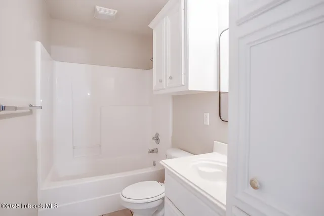 a bathroom with a toilet a sink and a bathtub