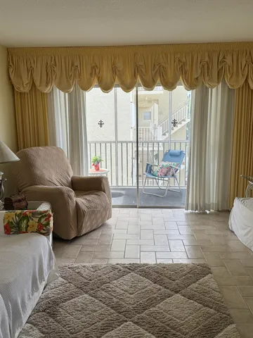 a living room with a couch and a large window
