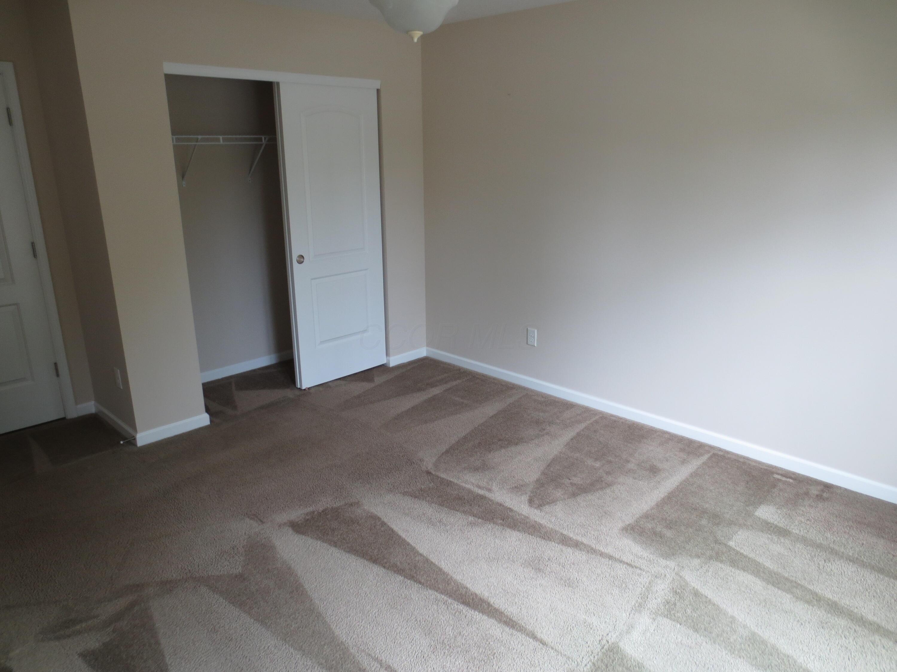 101 Merriston Circle Delaware, OH 43015 - Photo 18 of 34 Bedroom 2 with doorway to hall bathroom