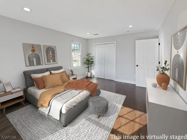 a bedroom with a large bed and a couch