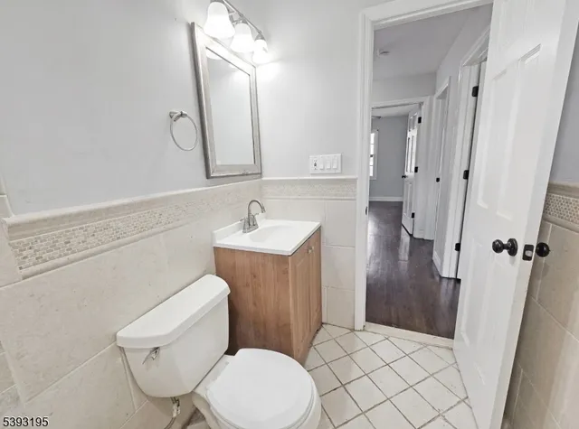 a bathroom with a toilet sink and shower