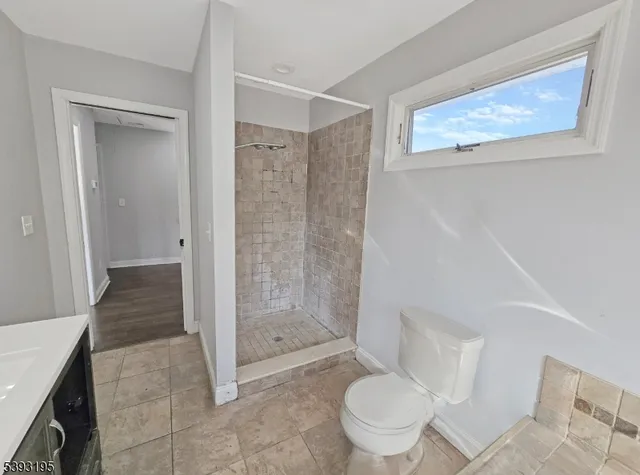 a bathroom with a shower and a toilet