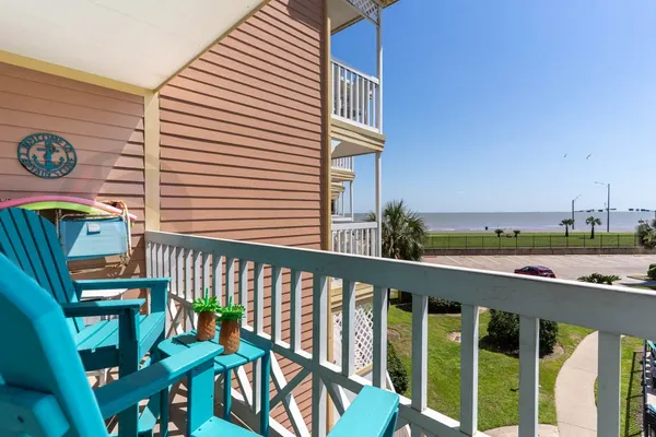 a view of a balcony with chairs