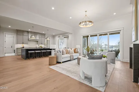 a dining room with furniture and wooden floor