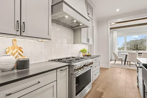 a spacious bathroom with a double vanity sink mirror and shower