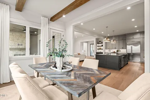 a bathroom with a double vanity sink toilet and mirror