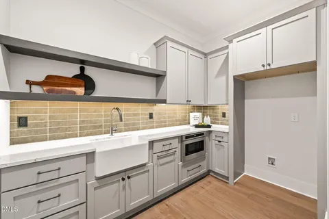 a kitchen with a sink and a refrigerator