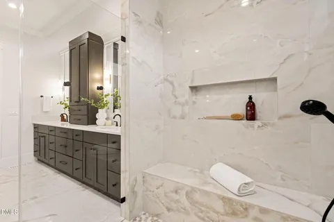 a bathroom with a bathtub and a shower
