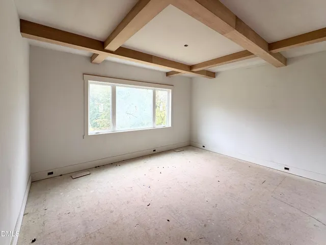 a kitchen that has a lot of cabinets and appliances
