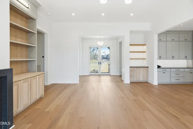 a view of a kitchen with wooden floor and a sink