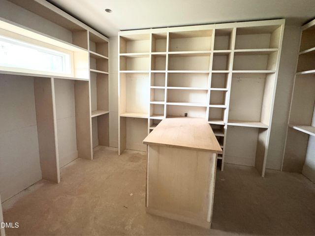 a view of hallway with windows