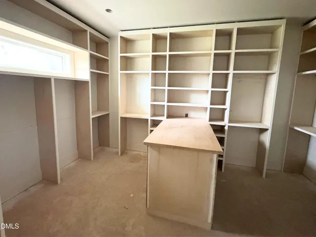 a view of hallway with windows