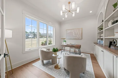 a living room with furniture and a table