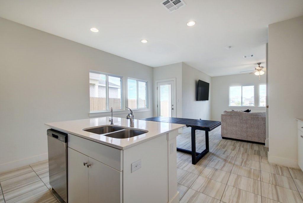 413 White Steppe Way Georgetown, TX 78626 - Photo 25 of 25 a kitchen with sink and center island