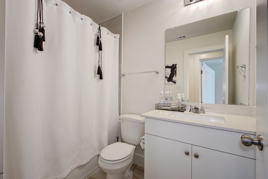 413 White Steppe Way Georgetown, TX 78626 - Photo 16 of 25 a bathroom with a sink toilet and shower