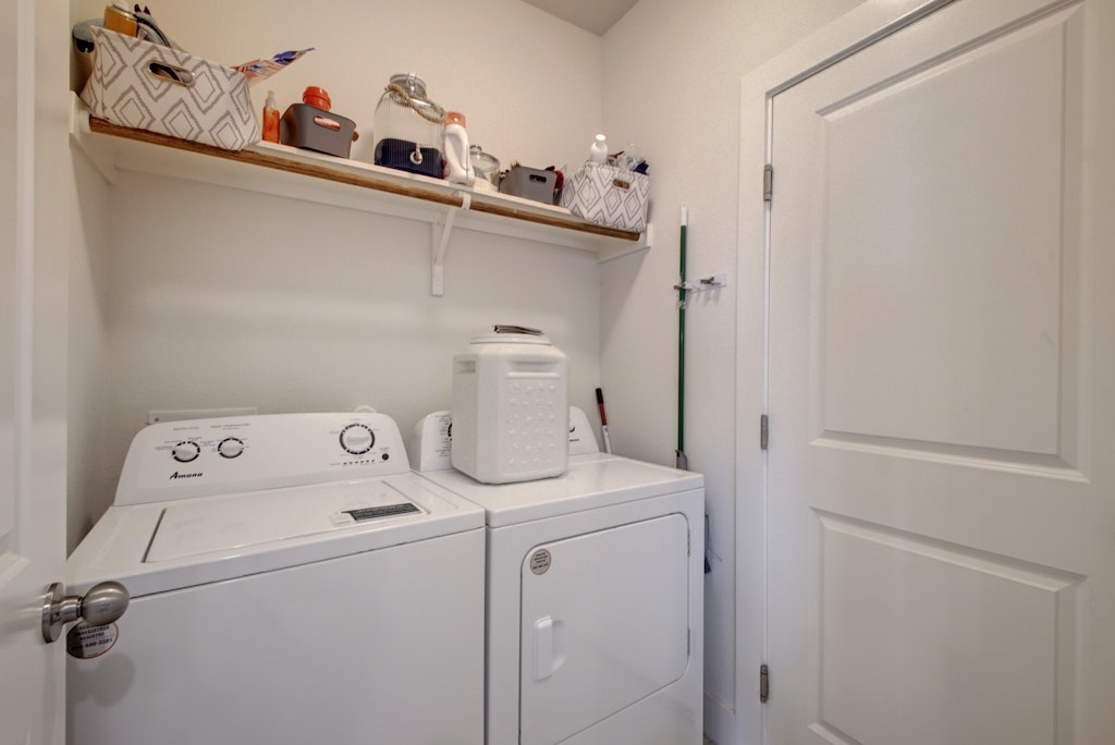 413 White Steppe Way Georgetown, TX 78626 - Photo 19 of 25 a utility room with dryer and washer