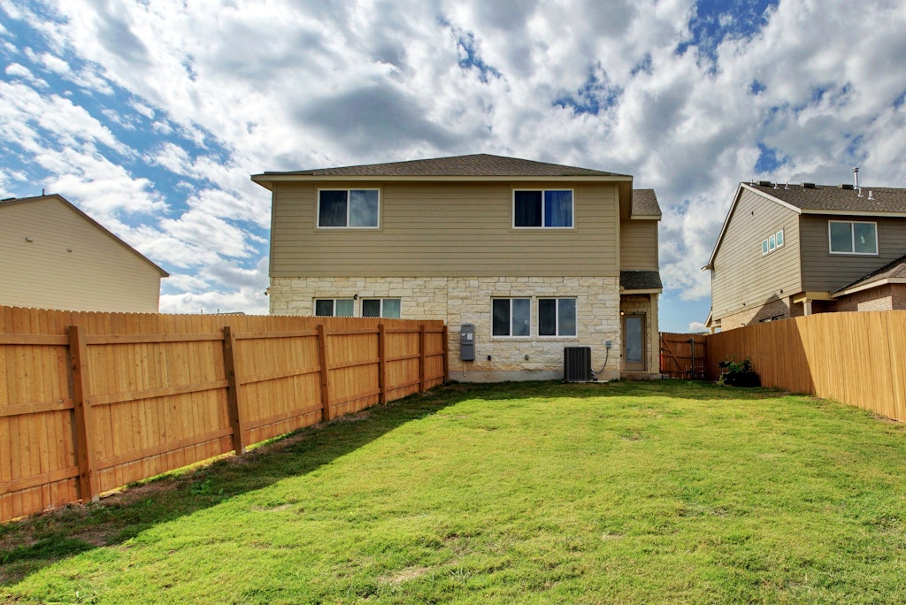 413 White Steppe Way Georgetown, TX 78626 - Photo 20 of 25 a backyard of a house with table and sofas