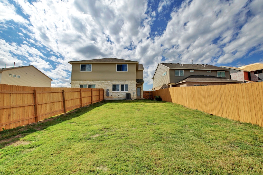 413 White Steppe Way Georgetown, TX 78626 - Photo 22 of 25 a view of a backyard of the house