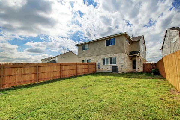a view of a backyard of the house