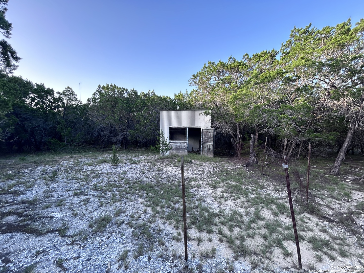 320 Frontier Lane Bandera, TX 78003 - Photo 6 of 11 a view of a house with a backyard