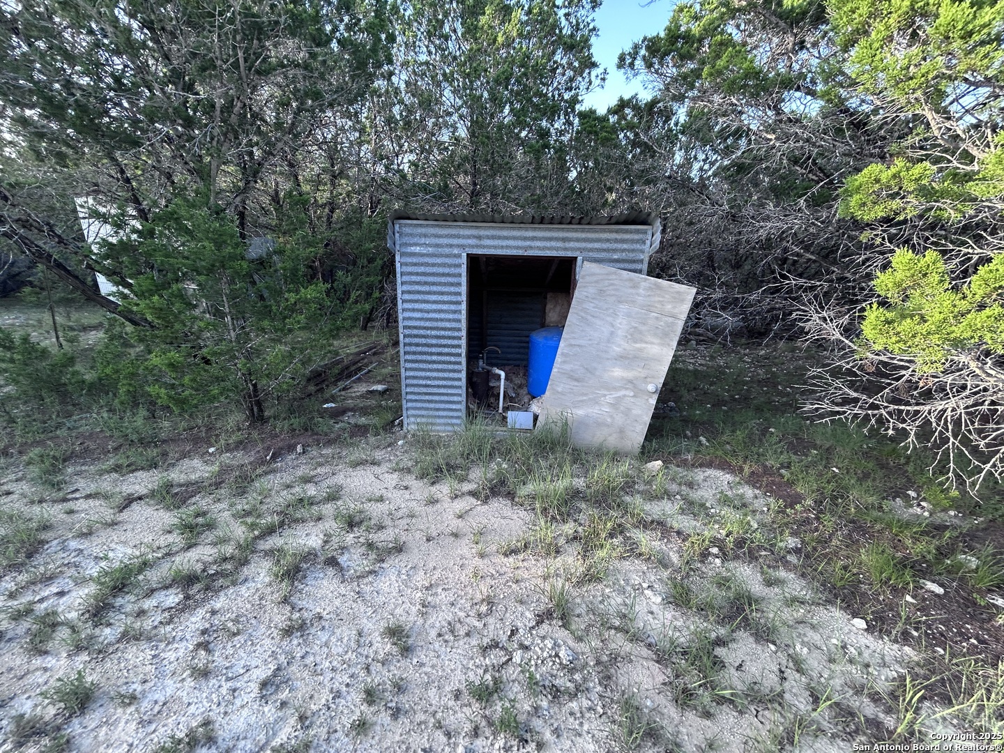 320 Frontier Lane Bandera, TX 78003 - Photo 8 of 11 a view of a backyard