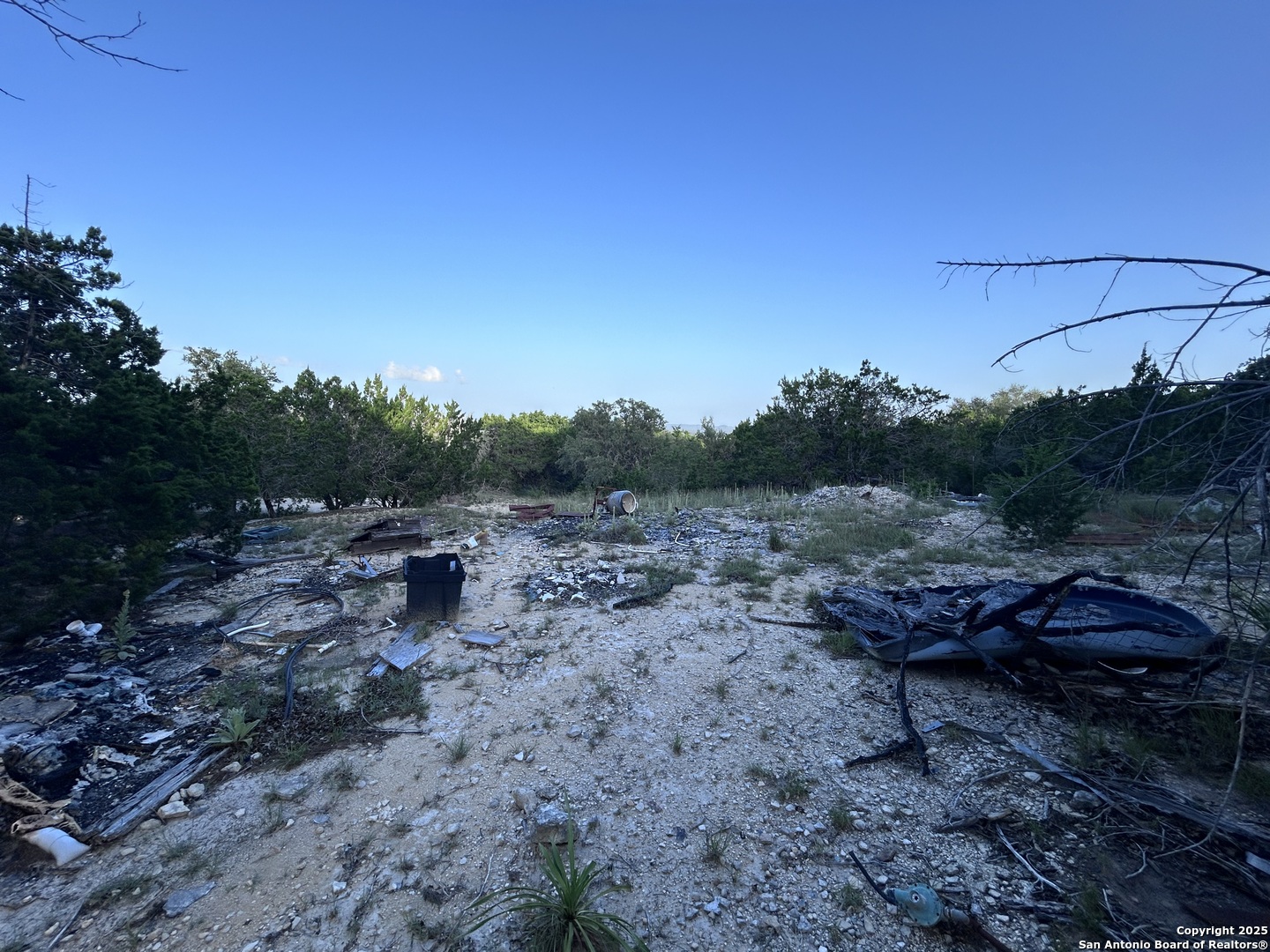 320 Frontier Lane Bandera, TX 78003 - Photo 9 of 11 a view of a backyard with couches and sky view