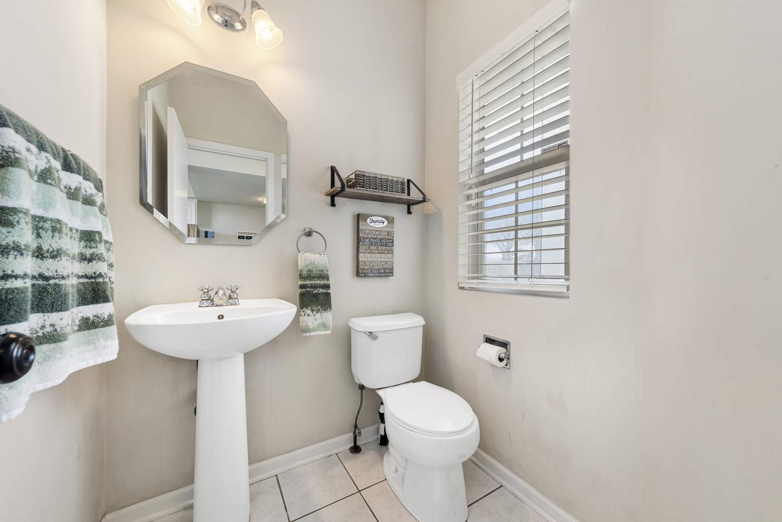 1020 Key Largo Drive Romeoville, IL 60446 - Photo 11 of 22 a bathroom with a sink a toilet and mirror