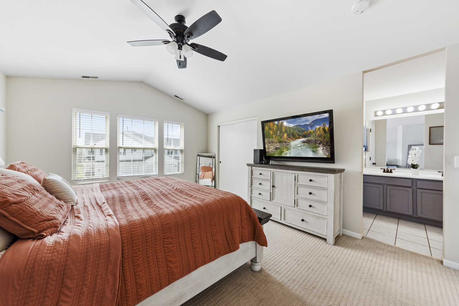 1020 Key Largo Drive Romeoville, IL 60446 - Photo 13 of 22 a bedroom with a bed a window and a chandelier