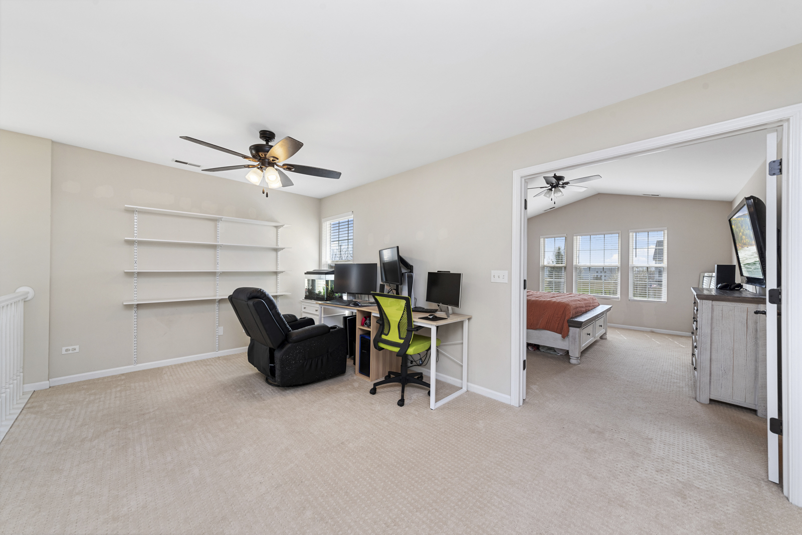 1020 Key Largo Drive Romeoville, IL 60446 - Photo 18 of 22 a view of a livingroom with furniture and a flat screen tv