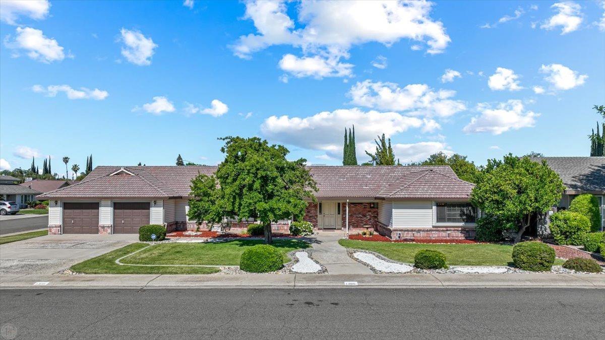 1305 Grover Drive Modesto, CA 95351 - Photo 1 of 1 a aerial view of a house with a yard and potted plants