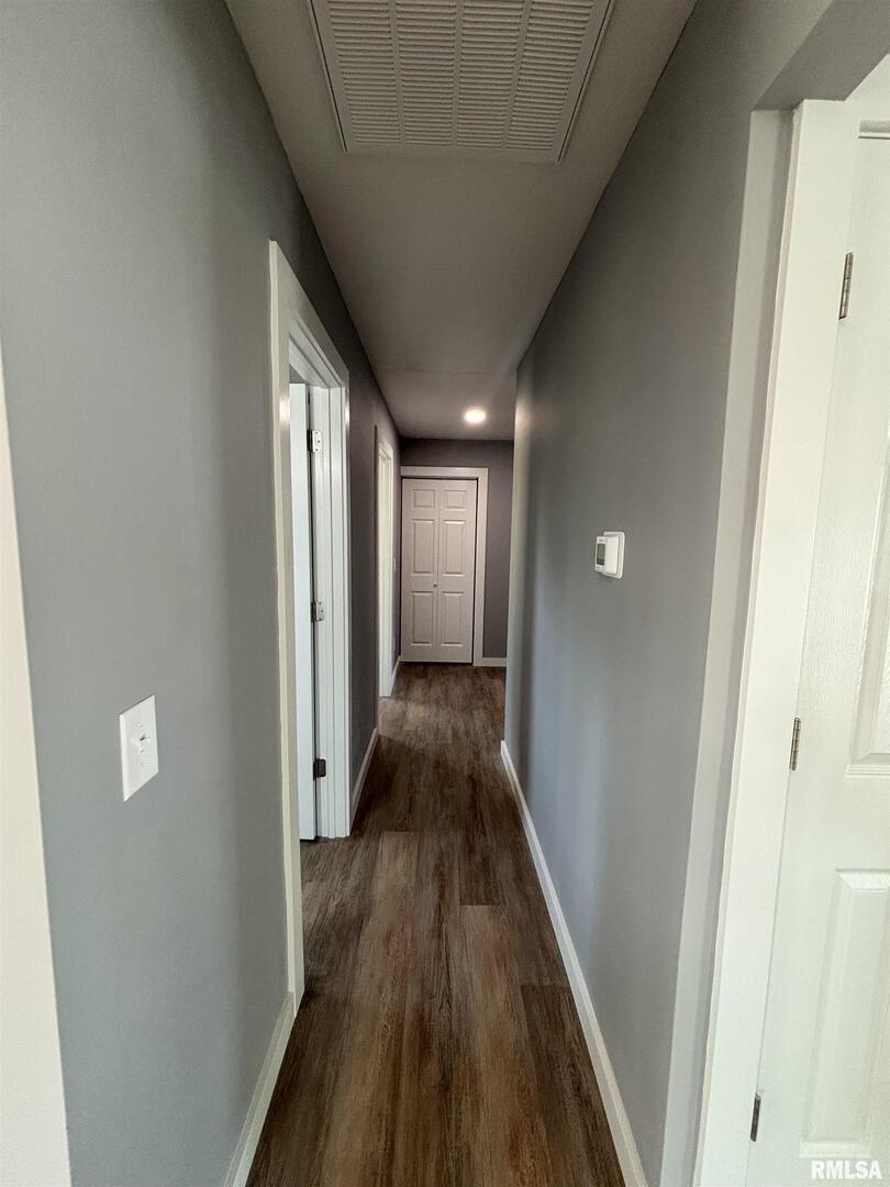 710 Catherine Street Metropolis, IL 62960 - Photo 16 of 18 a view of a hallway with wooden floor