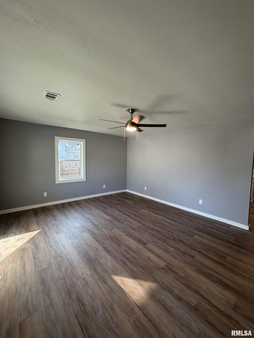 710 Catherine Street Metropolis, IL 62960 - Photo 4 of 18 a view of a room with wooden floors and window
