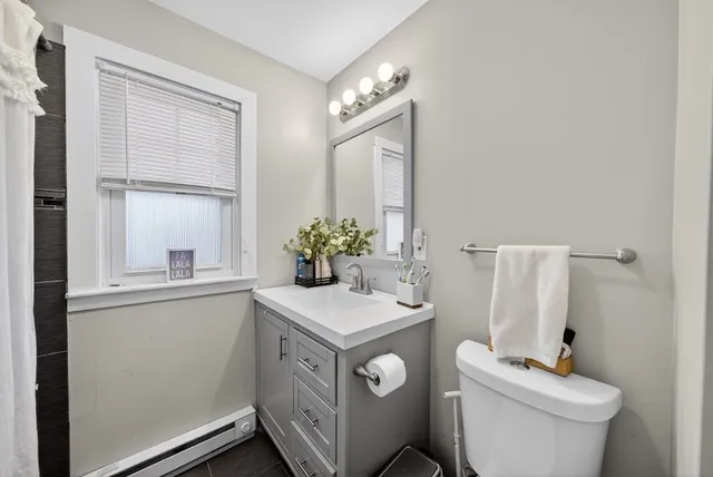 a bathroom with a glass shower door