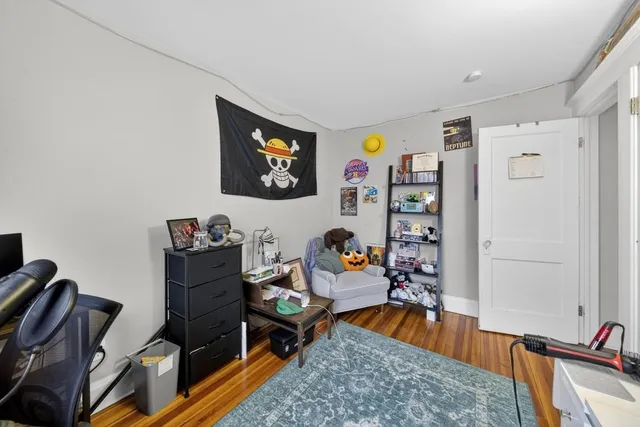 a view of a livingroom with furniture and a flat screen tv