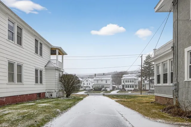 a front view of a house with a rug