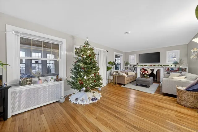 a view of a livingroom with furniture and a flat screen tv