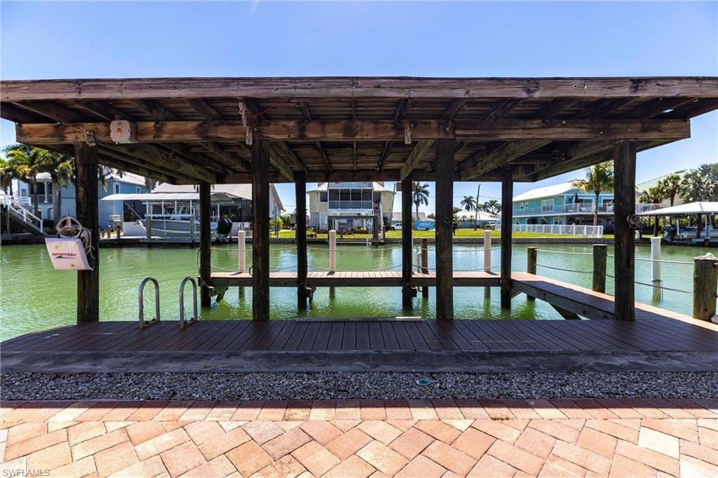164 Trinidad Street Naples, FL 34113 - Photo 17 of 43 a view of porch with a table and chairs