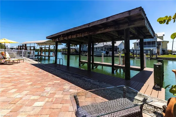 a view of a backyard with sitting area